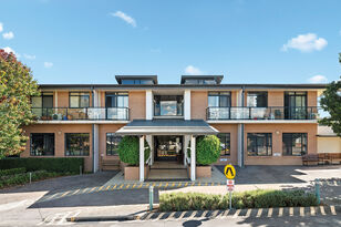 brick frontage of modern two story aged care home baptistcare blue hills manor residential aged care home in prestons sydney nsw