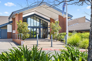 spacious outdoor sitting area under an awning of george forbes aged care home with dementia care in Queanbeyan nsw